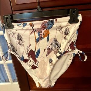 NWOT- Calia Carrie Underwood swim suit bottoms size S. Beautiful colors